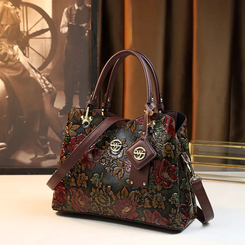 Sac à main rétro sculpté Floral LSDLBoutique, en cuir noir à motifs floraux rouges et dorés, anses bordeaux, logo doré